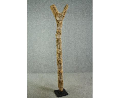 † A carved hardwood granary ladder, 20th century, West African, Dogon tribe.  H.196cm. 