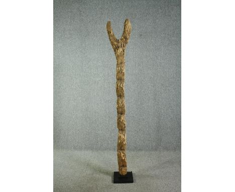 † A carved hardwood granary ladder, 20th century, West African, Dogon tribe. H.213cm. 