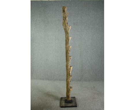 † A carved hardwood granary ladder, 20th century, West African, Dogon tribe. H.214cm. 