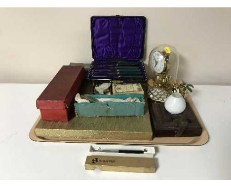 A tray containing anniversary clock under dome, several boxes of plated cutlery, vintage 'The Goblin' electric night lamp etc