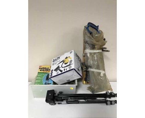 A box containing drill guide, hand tools, steam cleaner, camera tripod etc