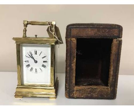 A brass striking and repeating carriage clock in travel case with key, striking on the hour and half-hour