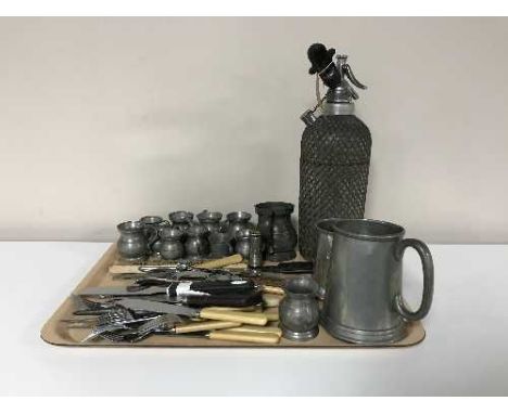 A tray of vintage soda syphon, miniature pewter tankards, assorted flatware etc 