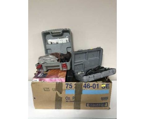 A box containing boxed Dremel set, boxed detail sander, other hand tools etc