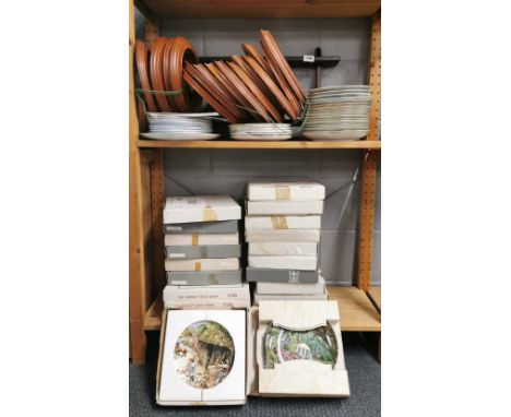 An extensive quantity of collectors plates, Royal Worcester and others, together with wooden frames and plate rack.