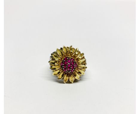 An interesting silver gilt and silver ruby and diamond set flower ring (s).