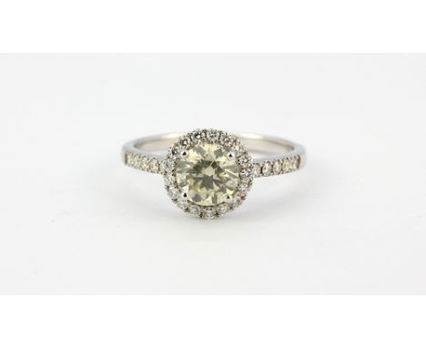 an 18ct white gold (stamped 750) halo ring set with a brilliant cut diamond surrounded by diamonds, approx. 1ct centre stone,