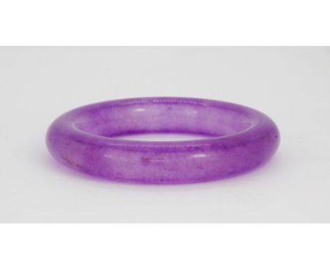 A polished lavender jade bangle, Dia. 9cm.