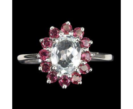 A 925 silver cluster ring set with an oval cut aquamarine surrounded by rodolite garnets, (R.5)