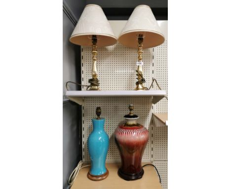 A pair of gilt brass table lamps and shades and two ceramic lamp bases, H. 47cm.