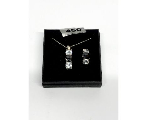 A stone set silver ring with matching pendant and chain.
