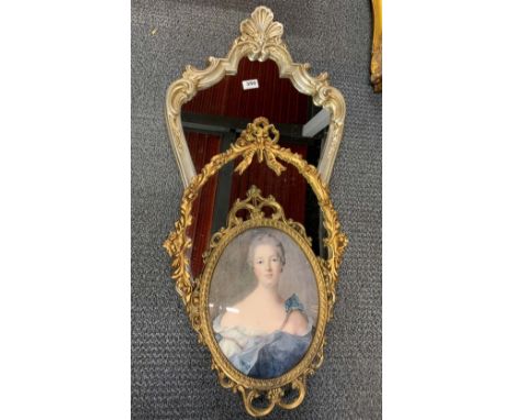 An ornate silvered finished wall mirror, H. 80cm. together with a gilt metal framed mirror and a metal framed portrait print.