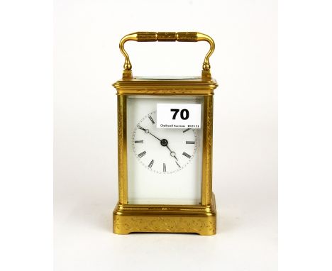 A gilt brass striking carriage clock, H. 18cm. Understood to be in working order.