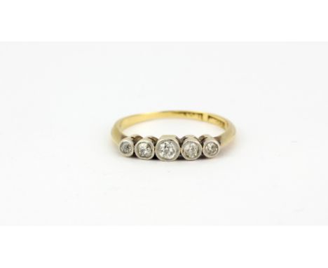 An 18ct yellow gold ring set with five graduated old cut diamonds, (L).