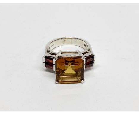 An impressive silver citrine and garnet set ring (s).