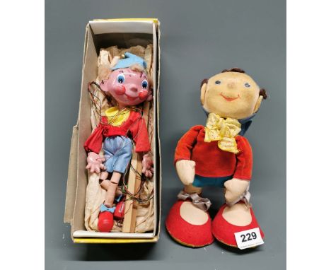 A felt and velvet figure of Noddy with sprung neck, H. 26cm. Together with a Pelham puppet of Noddy.