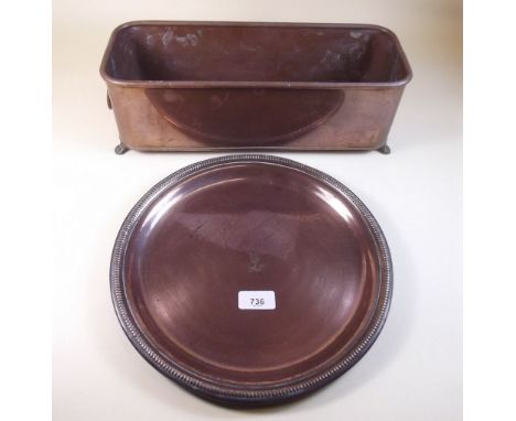 A circular copper tray and a small copper planter