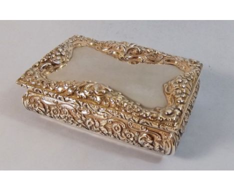 A silver snuff box by Nathaniel Mills with deep floral embossed border - Birmingham 1840, 190g - 9.5 x 6.5 x 3.5cm