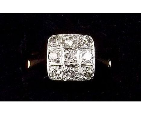 An 18 carat gold ring set square panel of nine diamonds - size O/P