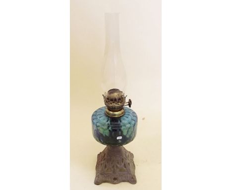 A Victorian oil lamp with blue glass reservoir