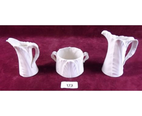 A Royal Worcester group of two white leaf form jugs and sugar bowl