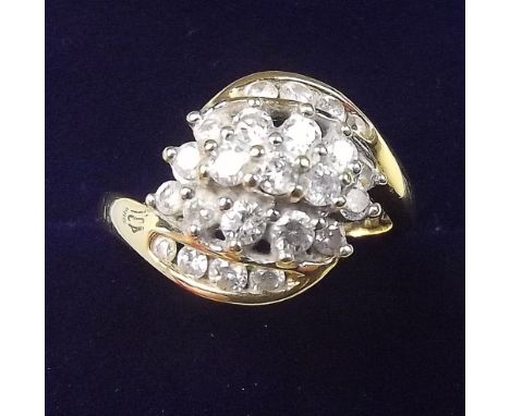 An 18 carat gold diamond set crossover panel ring - size L