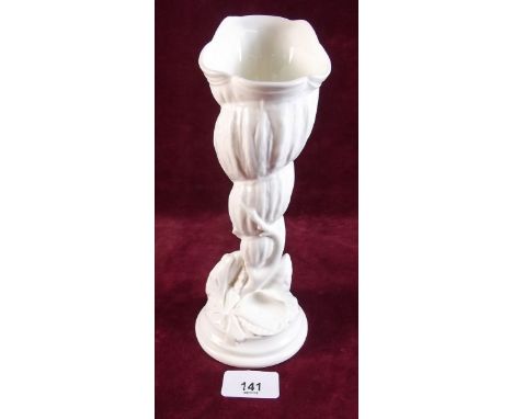 A Royal Worcester creamware vase with shell decoration 23cm tall