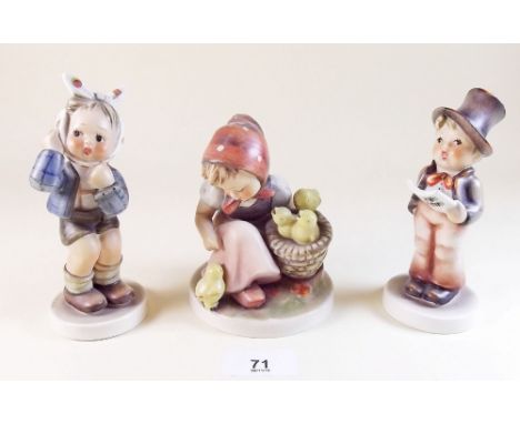 Three large Goebel figures:- girls with chicks, boy singing and boy with bandaged head