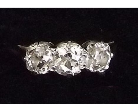 A platinum ring set three diamonds