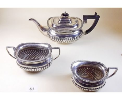 A silver three piece tea service with half gadrooned decoration by Cooper Bros and Sons, Sheffield 1912 - 1220g