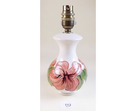 A Moorcroft table lamp painted peach hibiscus on a cream ground - 23cm