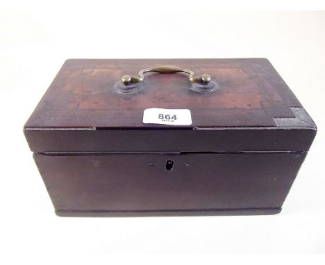 A Georgian mahogany tea caddy with brass handle and interior liner