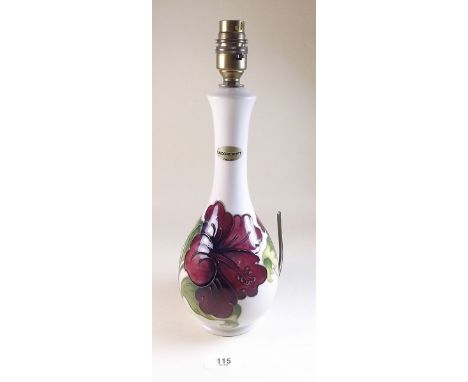 A Moorcroft table lamp painted red hibiscus on a cream ground - 34cm