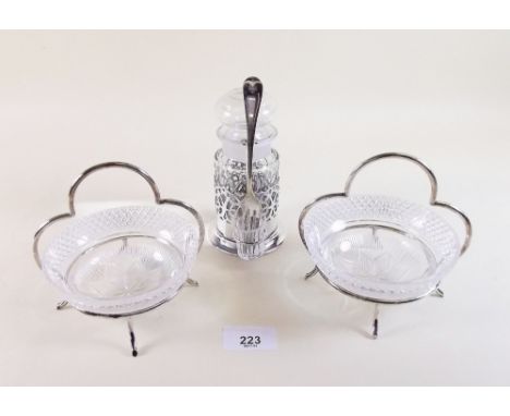 A pair of gilded glass bon bon dishes in silver plated stands and a silver plated and cut glass pickle jar with fork