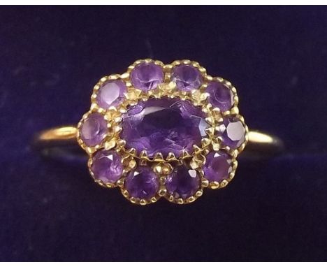 A 9 carat gold and amethyst cluster ring - size P