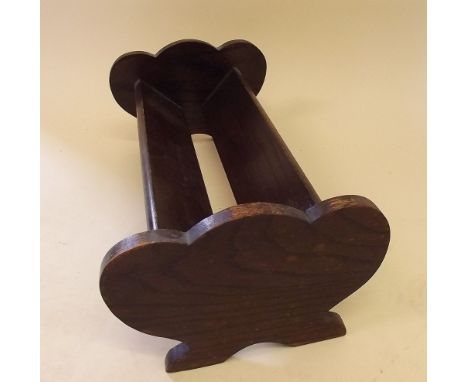 An early 20th century oak book trough