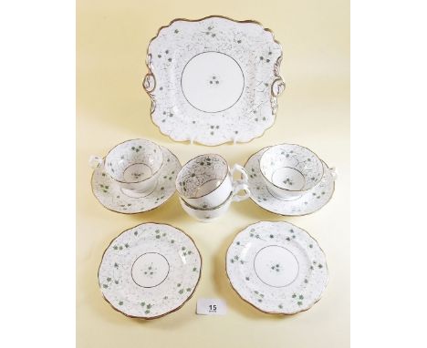 An early Victorian part tea service painted green flowers comprising five tea cups, seven coffee cups, ten saucers, two cake 