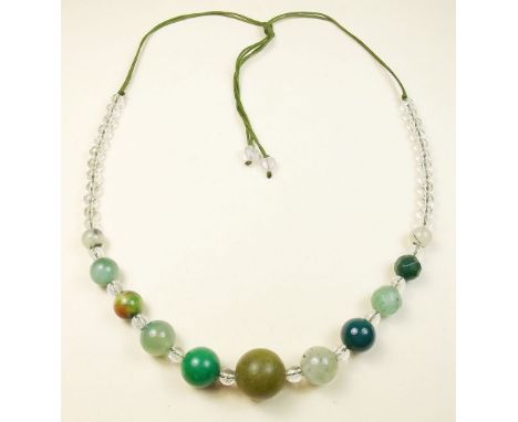 A jade and rock crystal string of beads