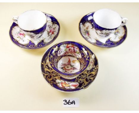 Three decorative floral painted Victorian cups and saucers