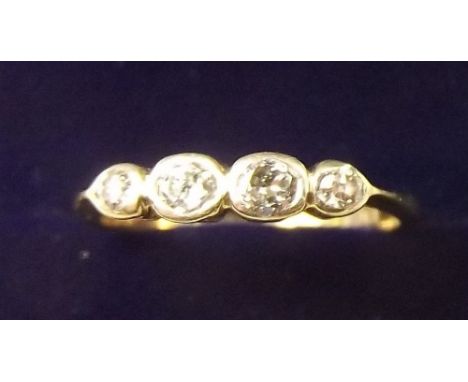 An 18 carat gold four stone diamond set ring - size I