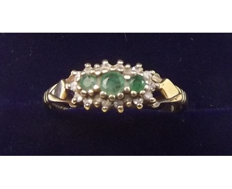 A 9 carat gold ring set three emeralds - size Q
