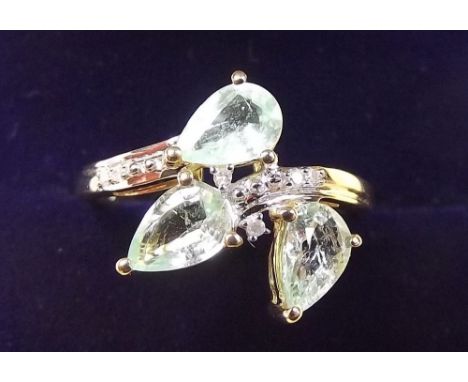 A 9 carat gold Paraiba tourmaline and diamond spray ring - size K 1/2