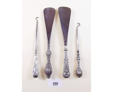 Four silver button hooks/shoe horns