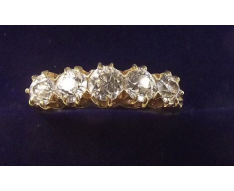 An 18 carat gold five stone diamond ring