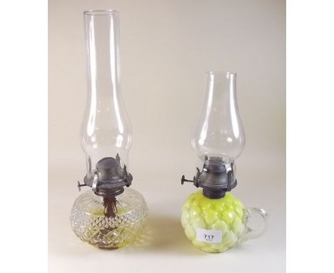 A yellow glass oil lamp and a cut glass one