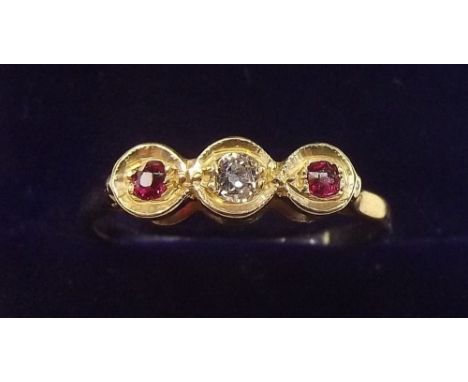 An 9 carat gold ring set diamond and red stones - size L