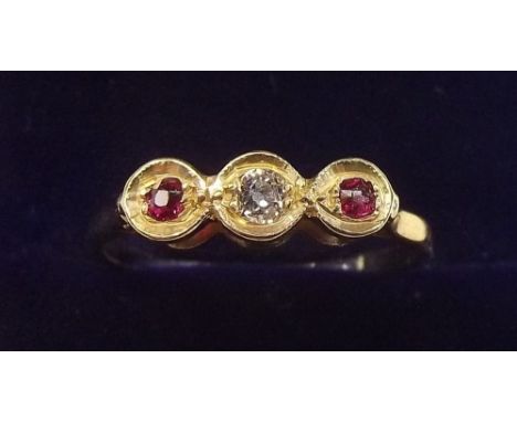 An 9 carat gold ring set diamond and red stones - size L