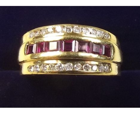 An 18 carat gold ruby and diamond ring - size Q