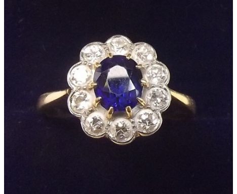 An 18 carat gold sapphire and diamond cluster ring, size O