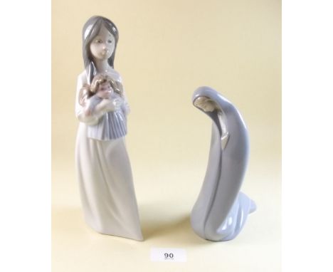 A Lladro figure of a nun and a Nao figure of girl with doll